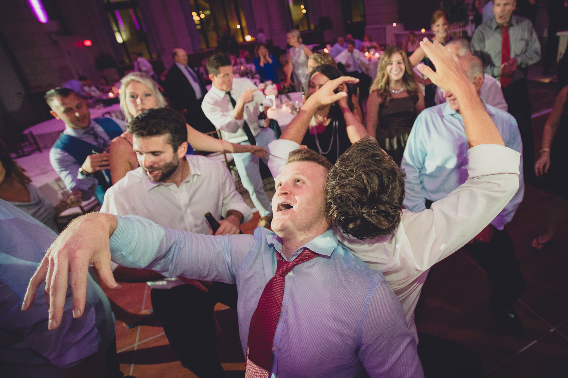 Guests dance in the Admiral Room Ballroom wedding reception venue in downtown Buffalo, NY