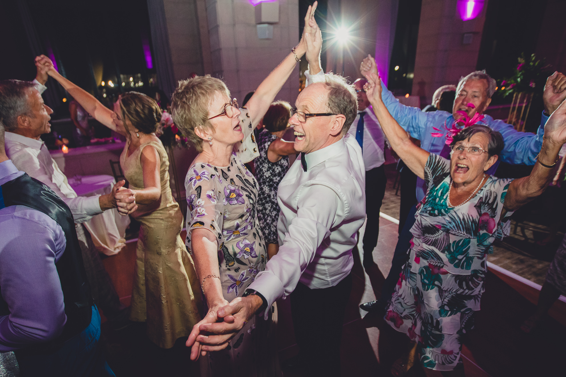 Guests dance in the Admiral Room Ballroom wedding reception venue in downtown Buffalo, NY
