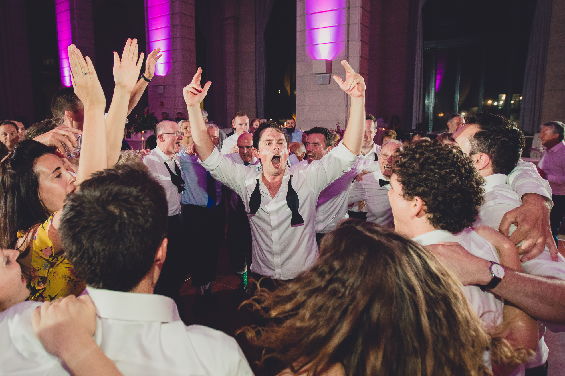 Guests dance in the Admiral Room Ballroom wedding reception venue in downtown Buffalo, NY