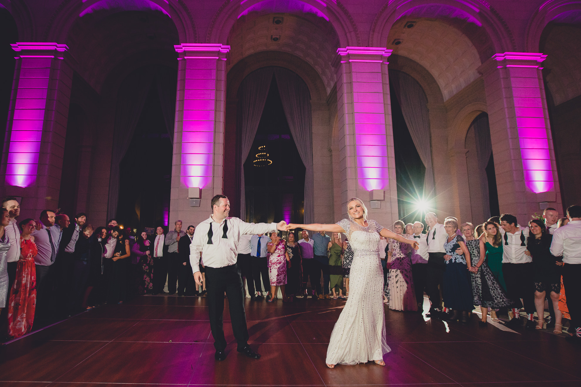 Guests dance in the Admiral Room Ballroom wedding reception venue in downtown Buffalo, NY