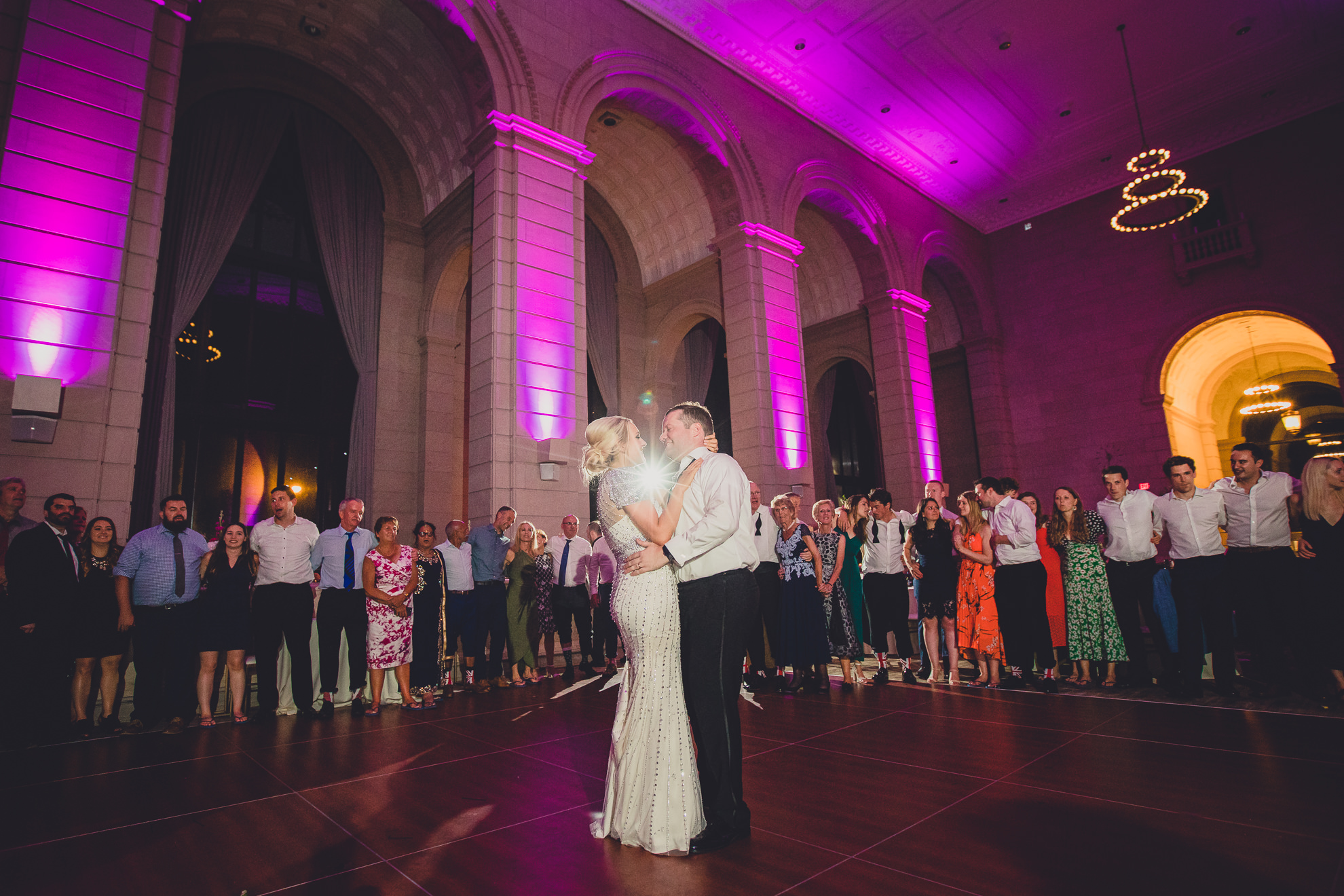 Guests dance in the Admiral Room Ballroom wedding reception venue in downtown Buffalo, NY