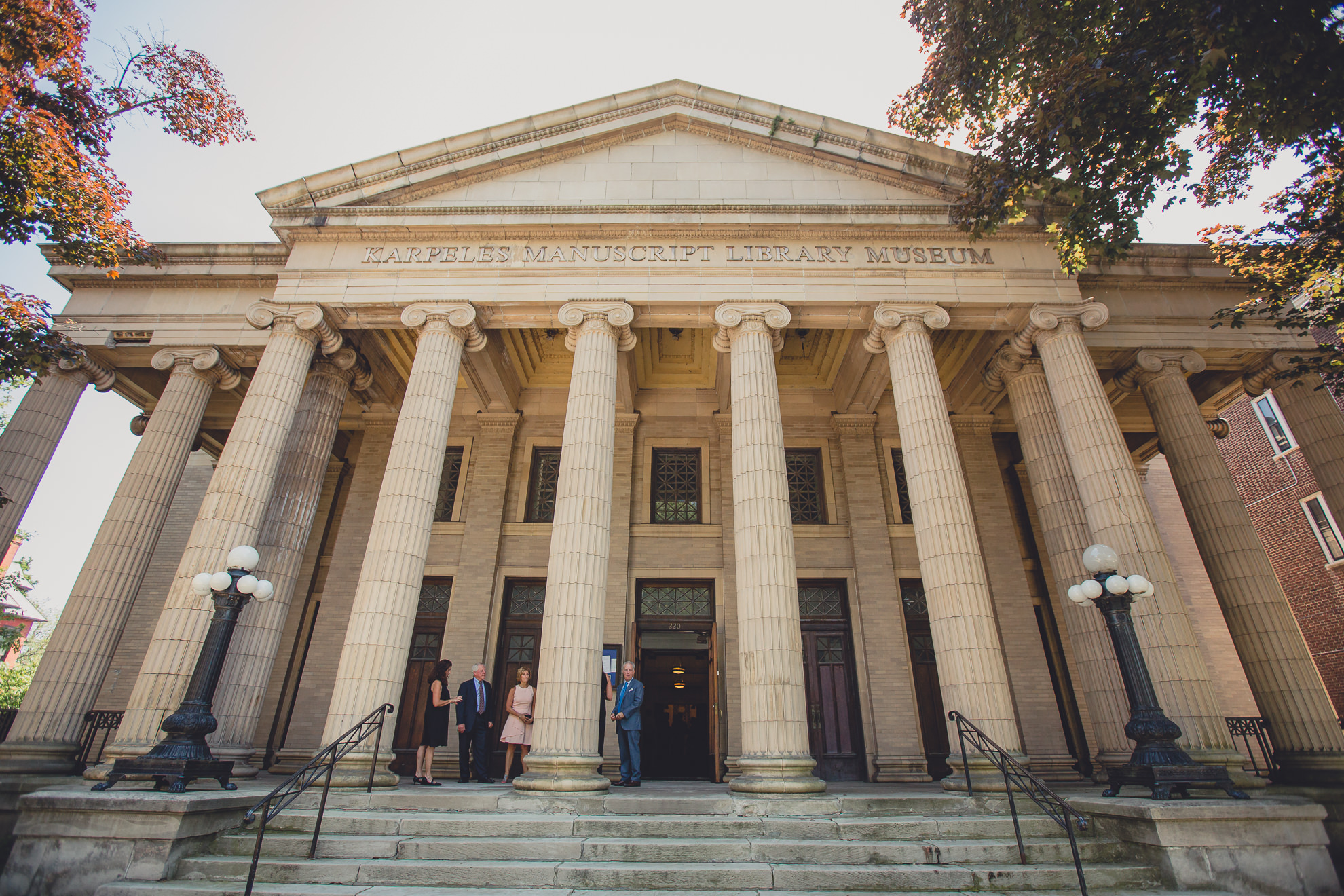 guests wait outside before wedding ceremony at Karpeles Manuscript Library in Buffalo, NY