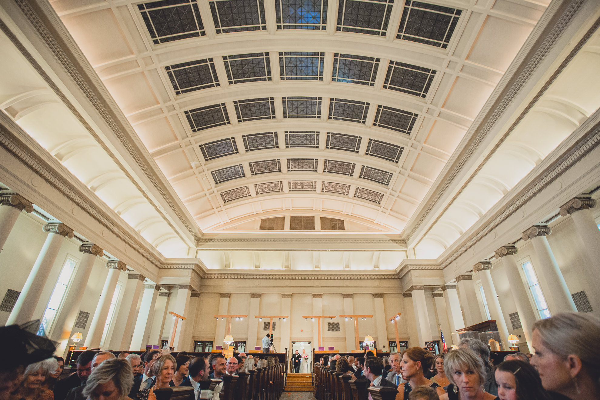 bride and dad during processional during wedding ceremony at Karpeles Manuscript Library in Buffalo, NY