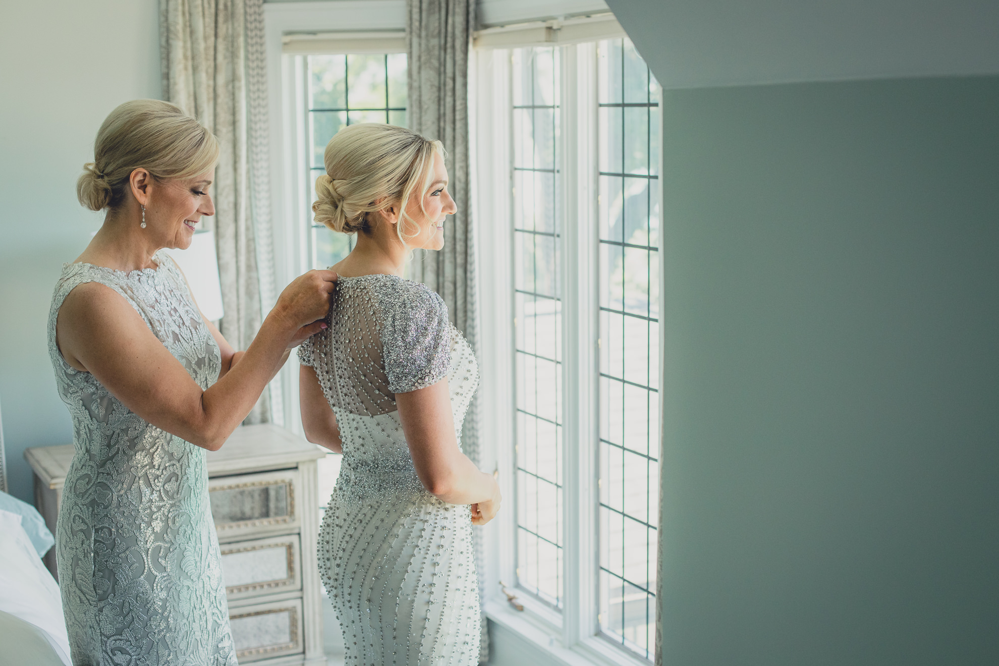 mom helps bride get ready for wedding in Lewiston, NY