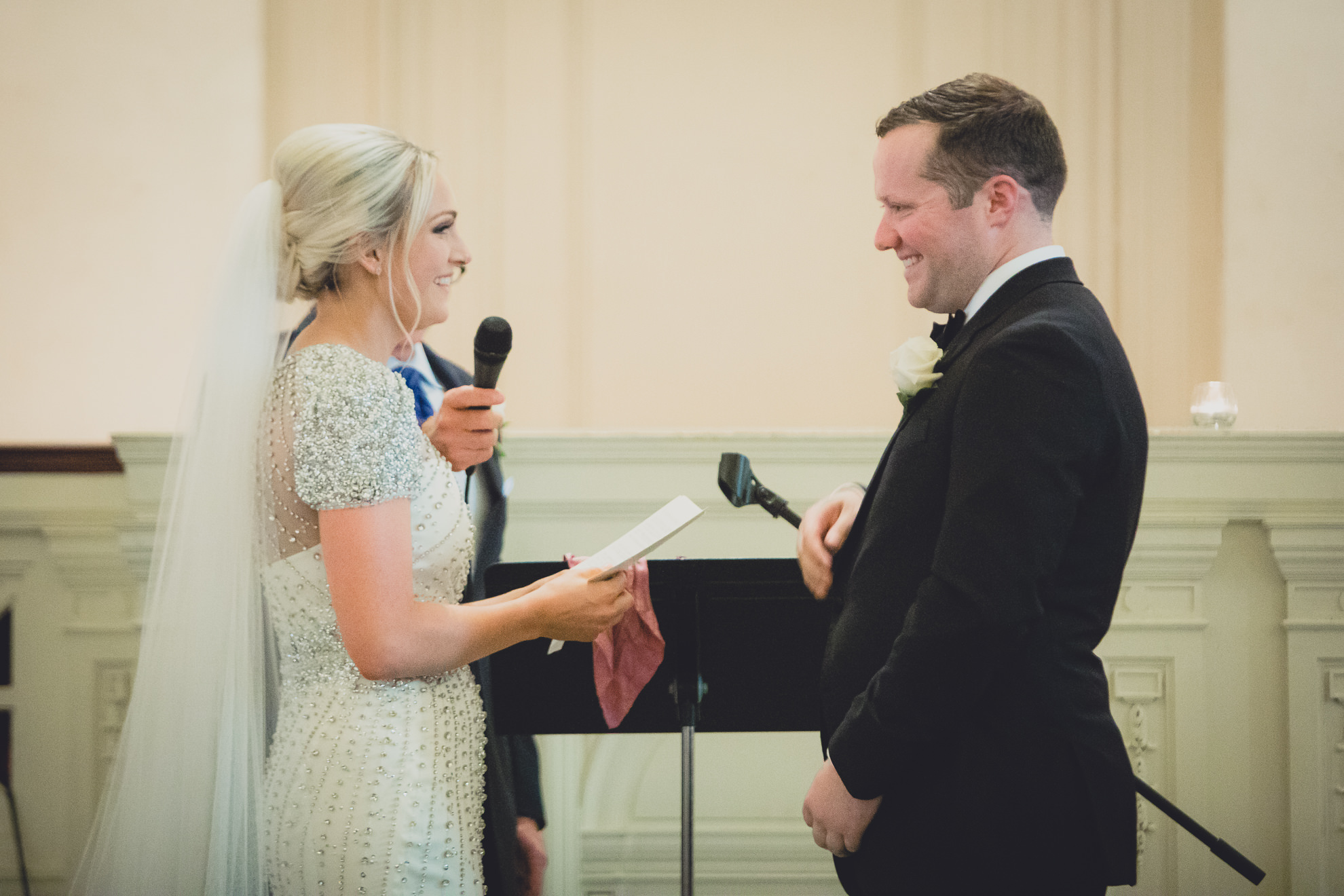 bride and groom say vows during wedding ceremony at Karpeles Manuscript Library in Buffalo, NY