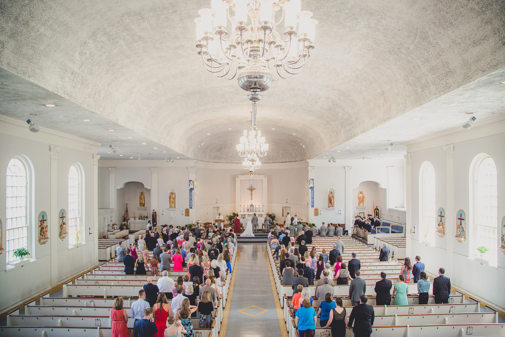 photography from balcony of church during wedding ceremony at St. John the Baptist church in Kenmore, NY