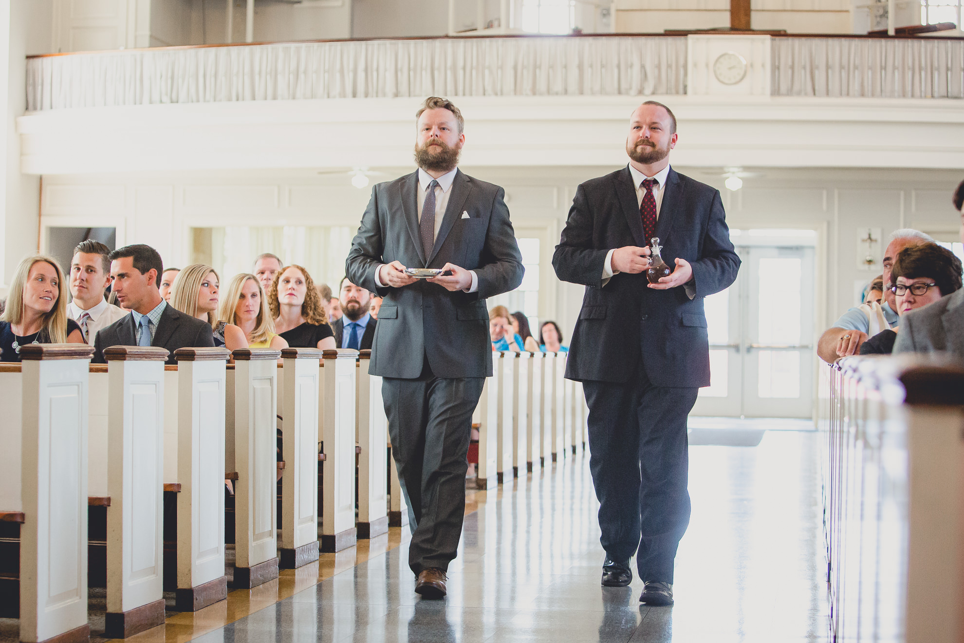 guests bring up gifts during wedding ceremony at St. John the Baptist church in Kenmore, NY