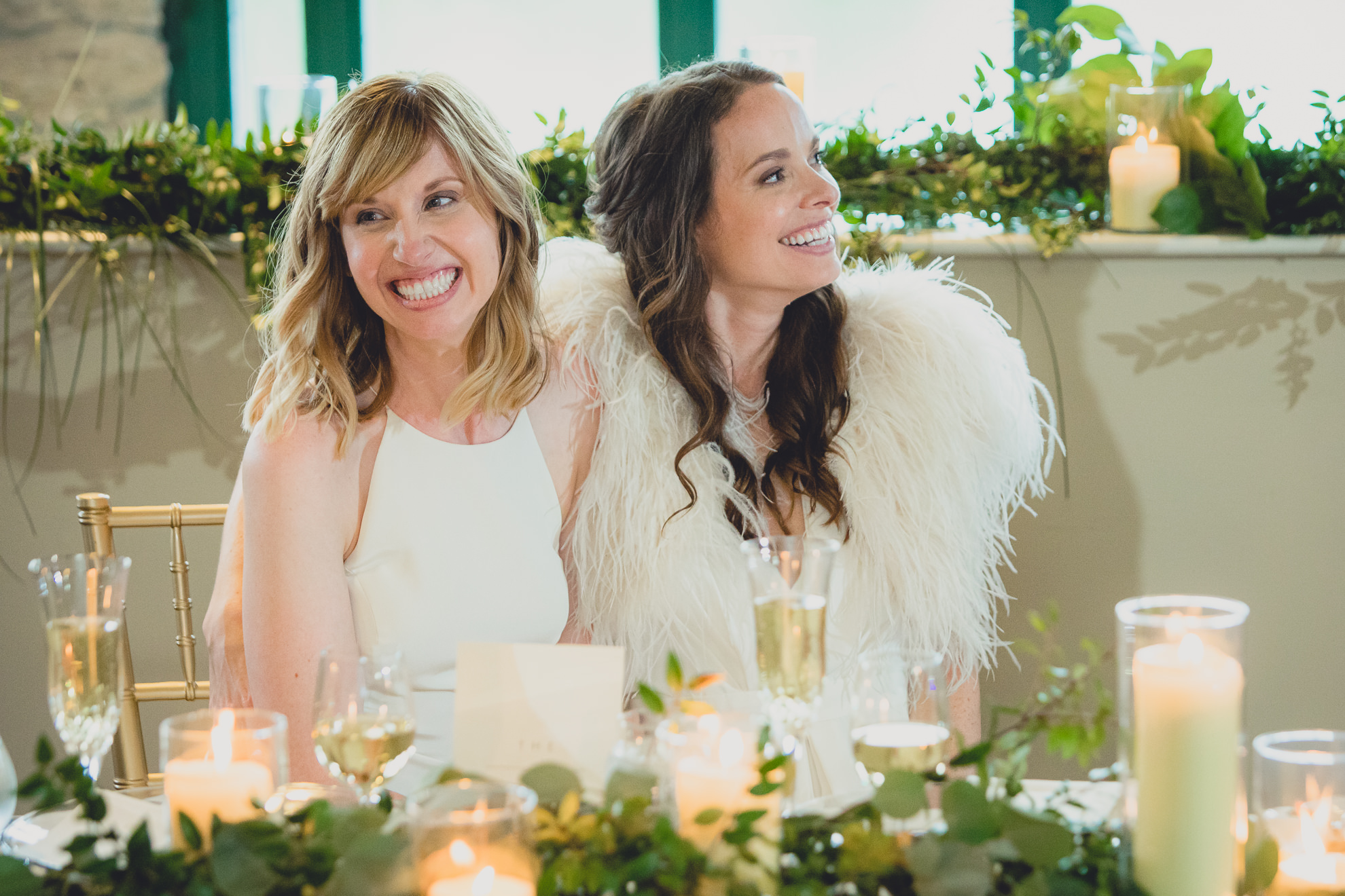 brides laugh during speech during wedding at Marcy Casino in Delaware Park in Buffalo, NY