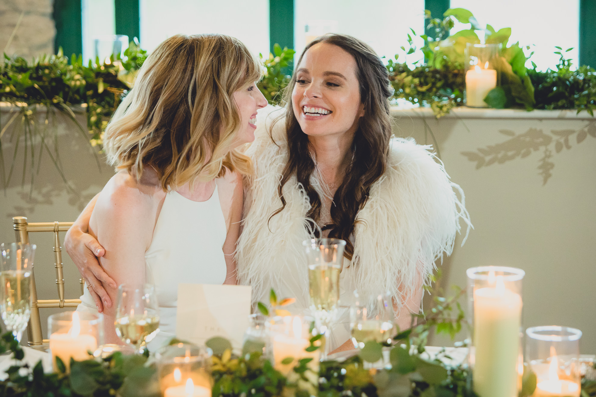 brides laugh during speech during wedding at Marcy Casino in Delaware Park in Buffalo, NY