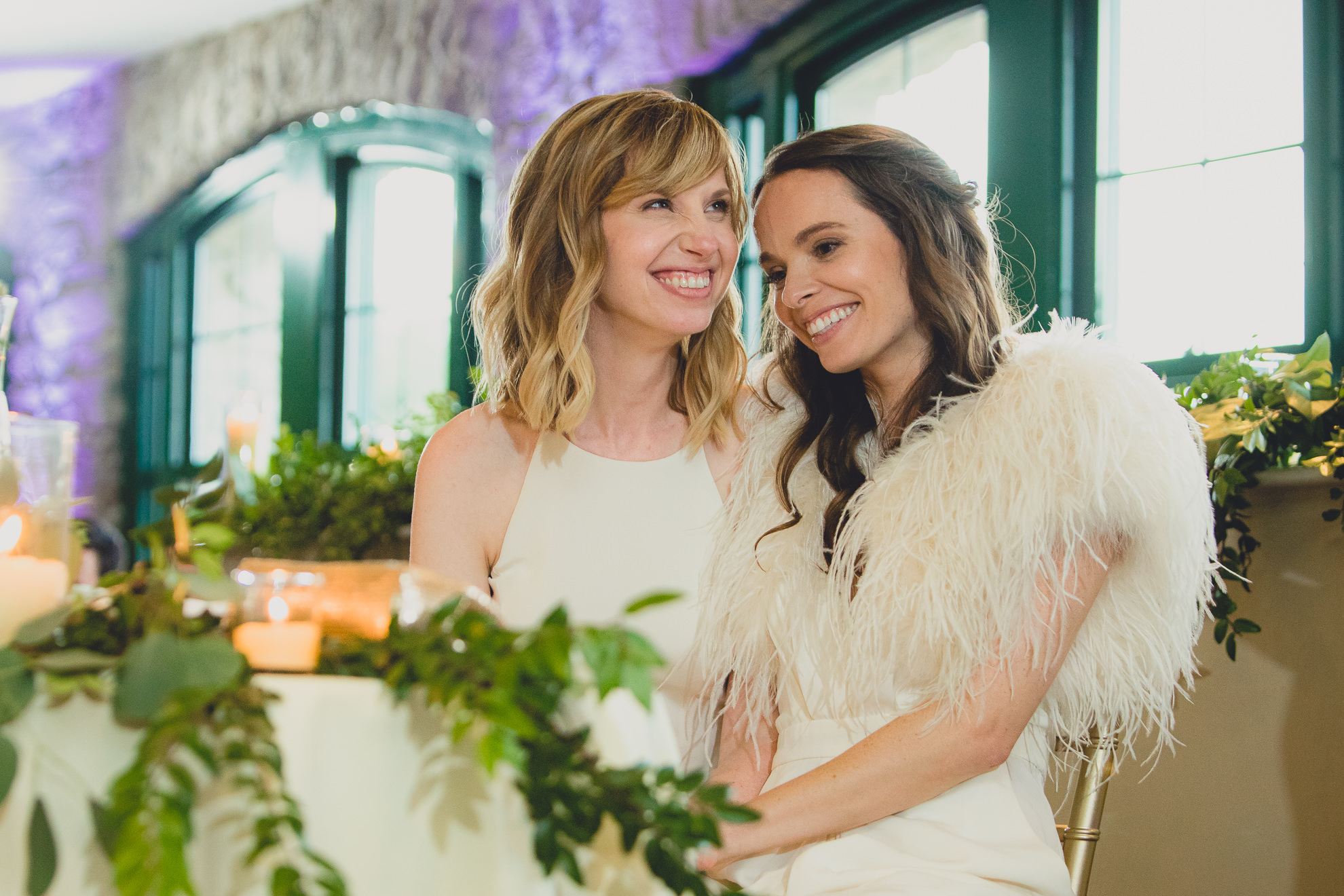 brides laugh at speech during wedding at Marcy Casino in Delaware Park in Buffalo, NY