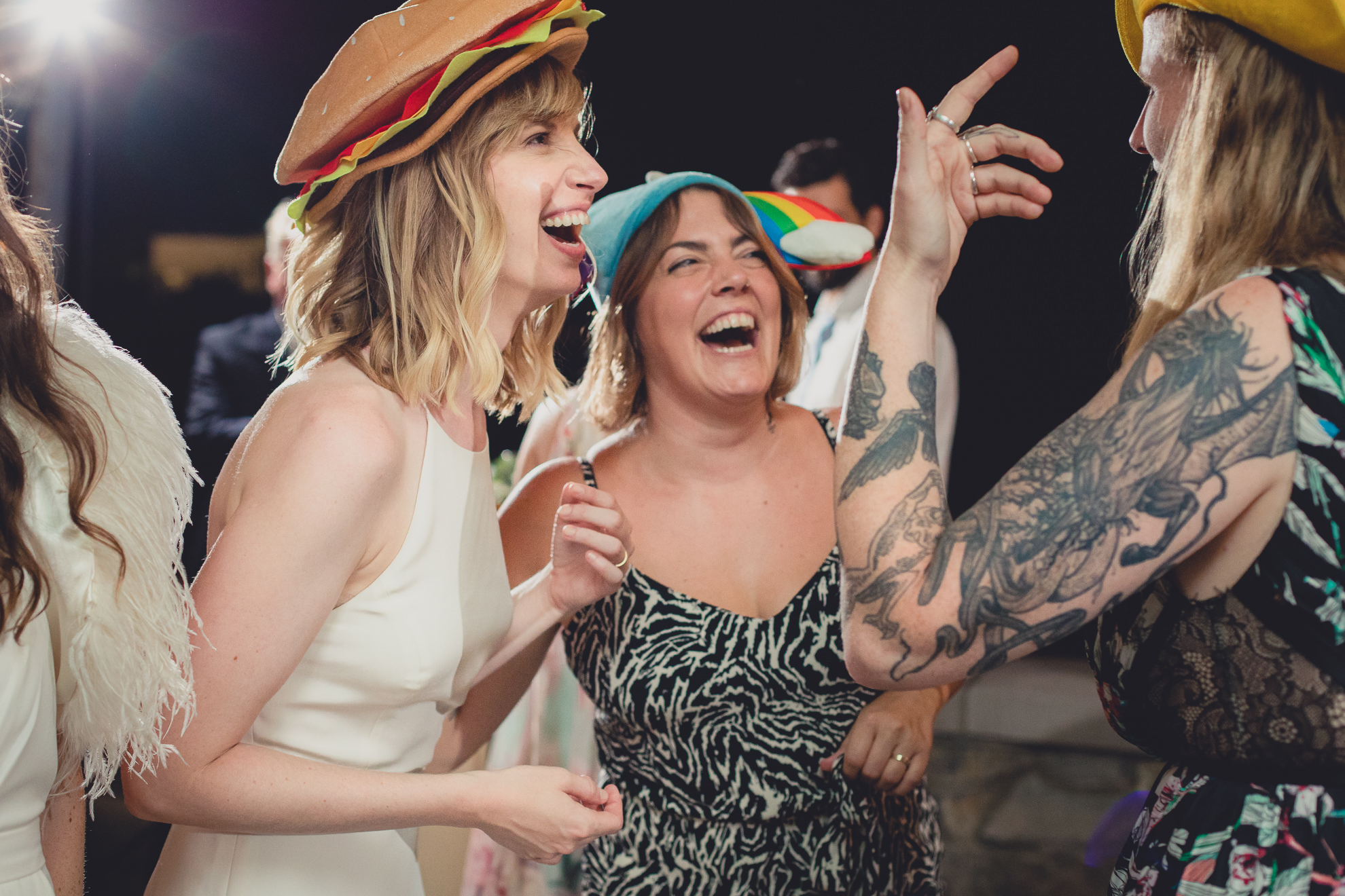 guests laugh while dancing during wedding at Marcy Casino in Delaware Park in Buffalo, NY