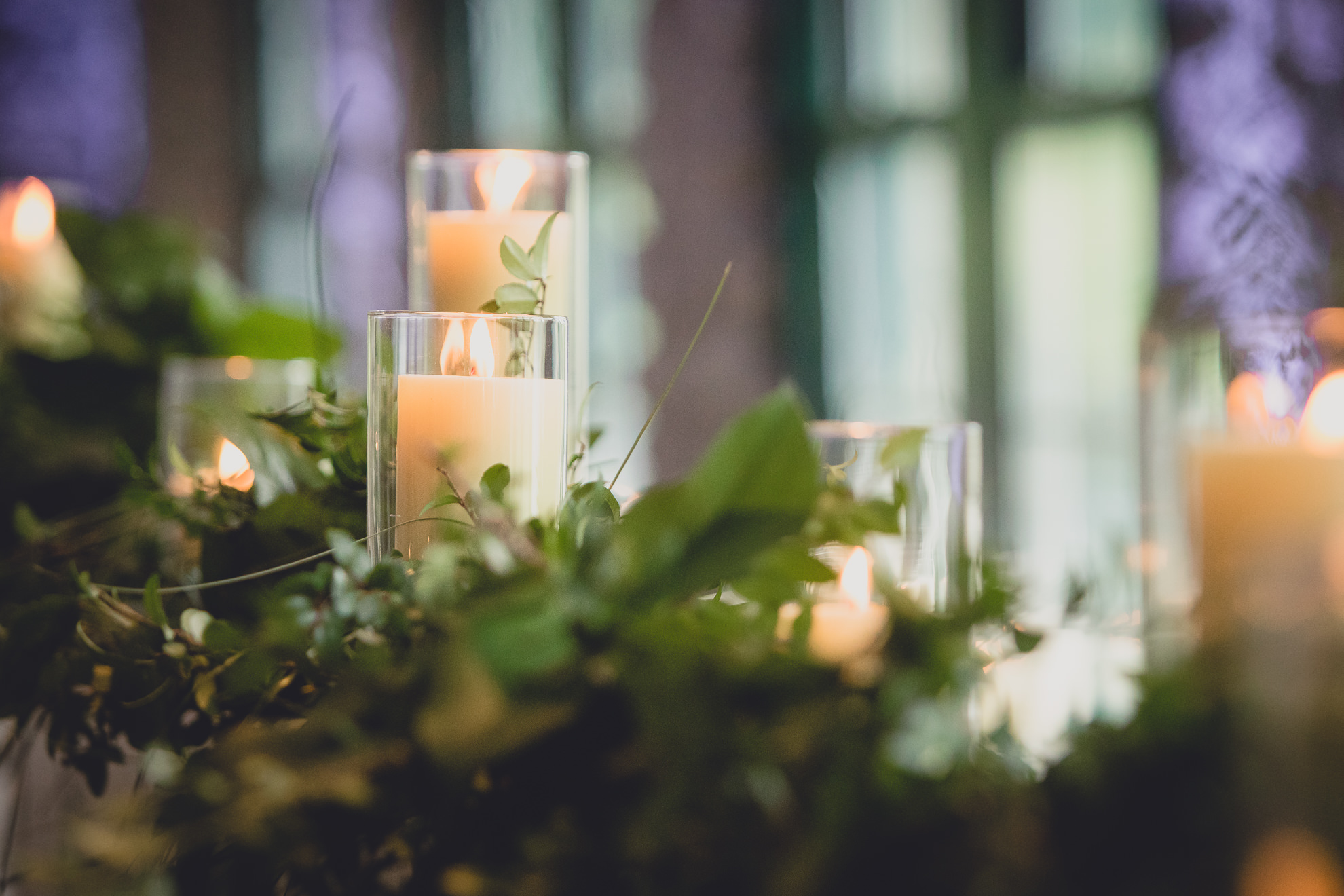 candle and greens decor during wedding at Marcy Casino in Delaware Park in Buffalo, NY