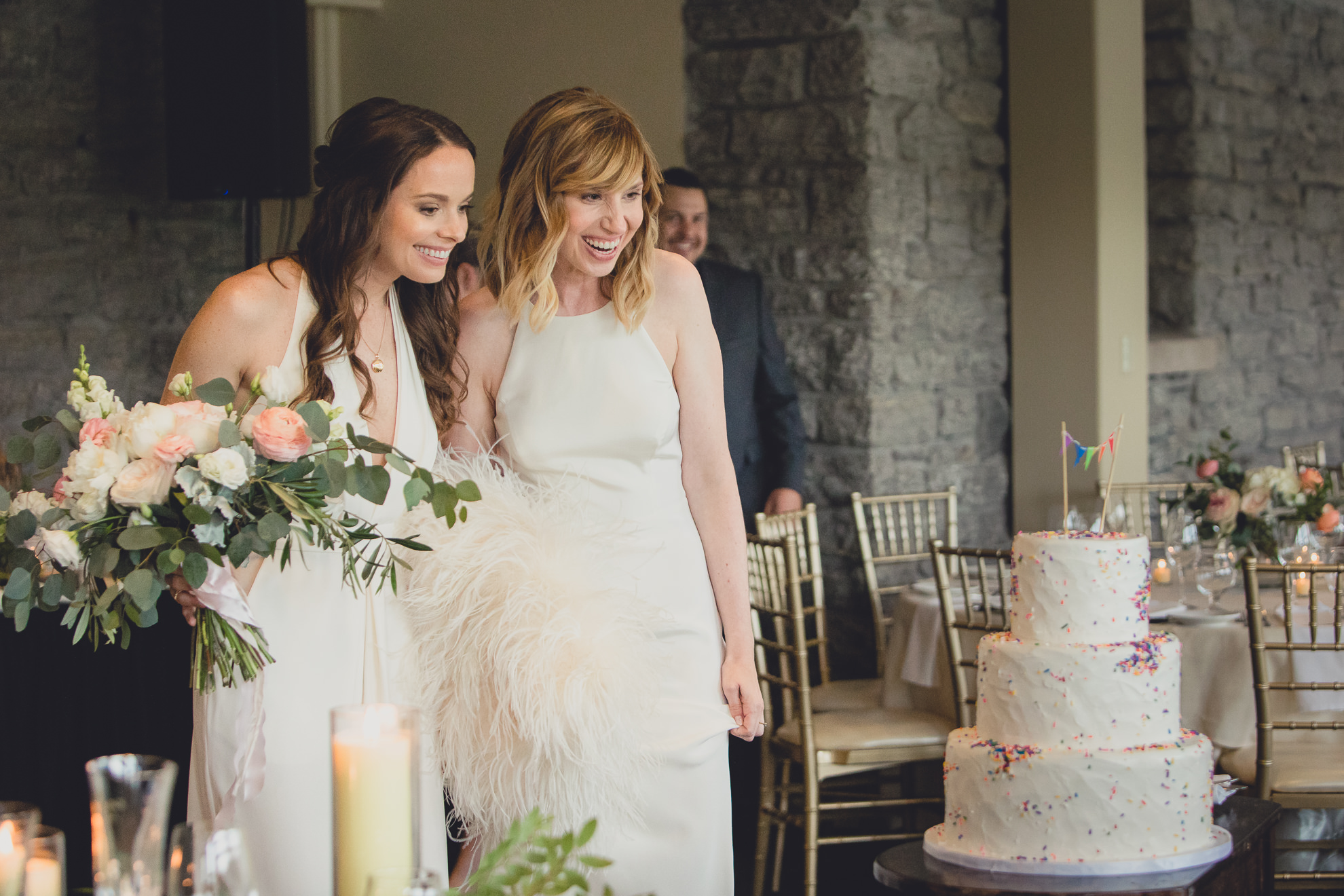 brides react to seeing wedding decor during wedding at Marcy Casino in Delaware Park in Buffalo, NY