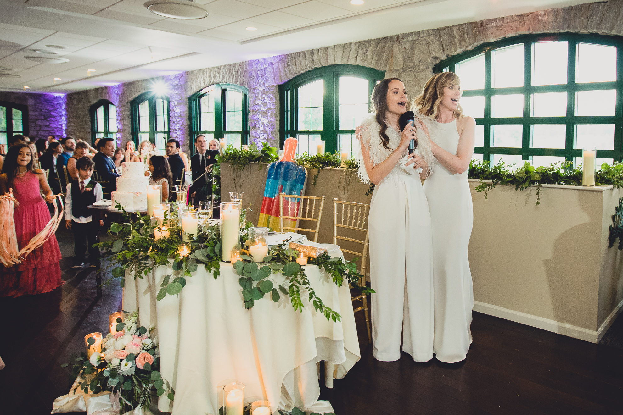 brides sing happy birthday to you during wedding at Marcy Casino in Delaware Park in Buffalo, NY