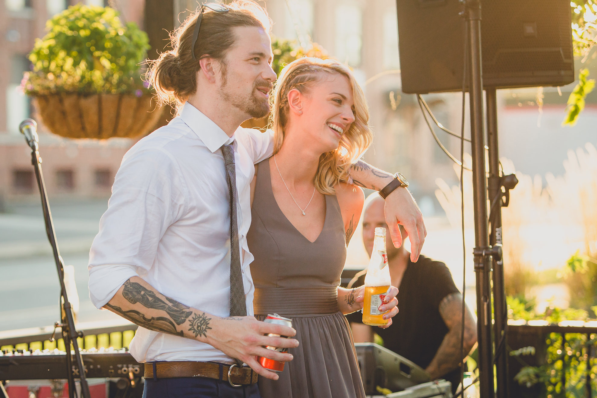 best man and maid of honor deliver speeches during outdoor wedding reception at the Revelry in Rochester, NY 
