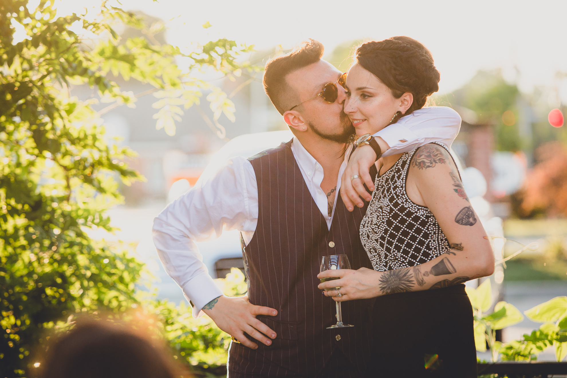 bride and groom react to speeches during outdoor wedding reception at the Revelry in Rochester, NY 