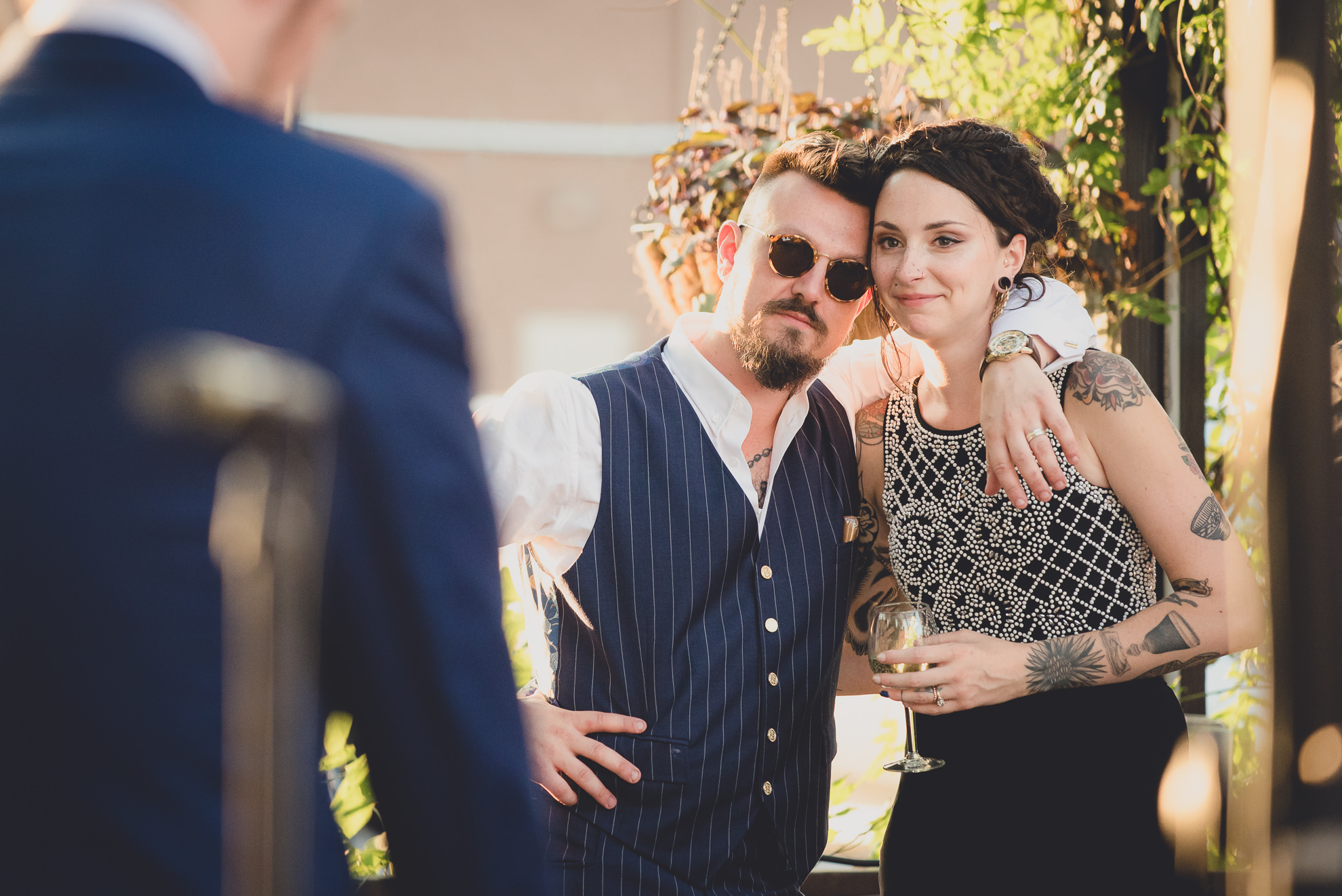 bride and groom react to speeches during outdoor wedding reception at the Revelry in Rochester, NY 