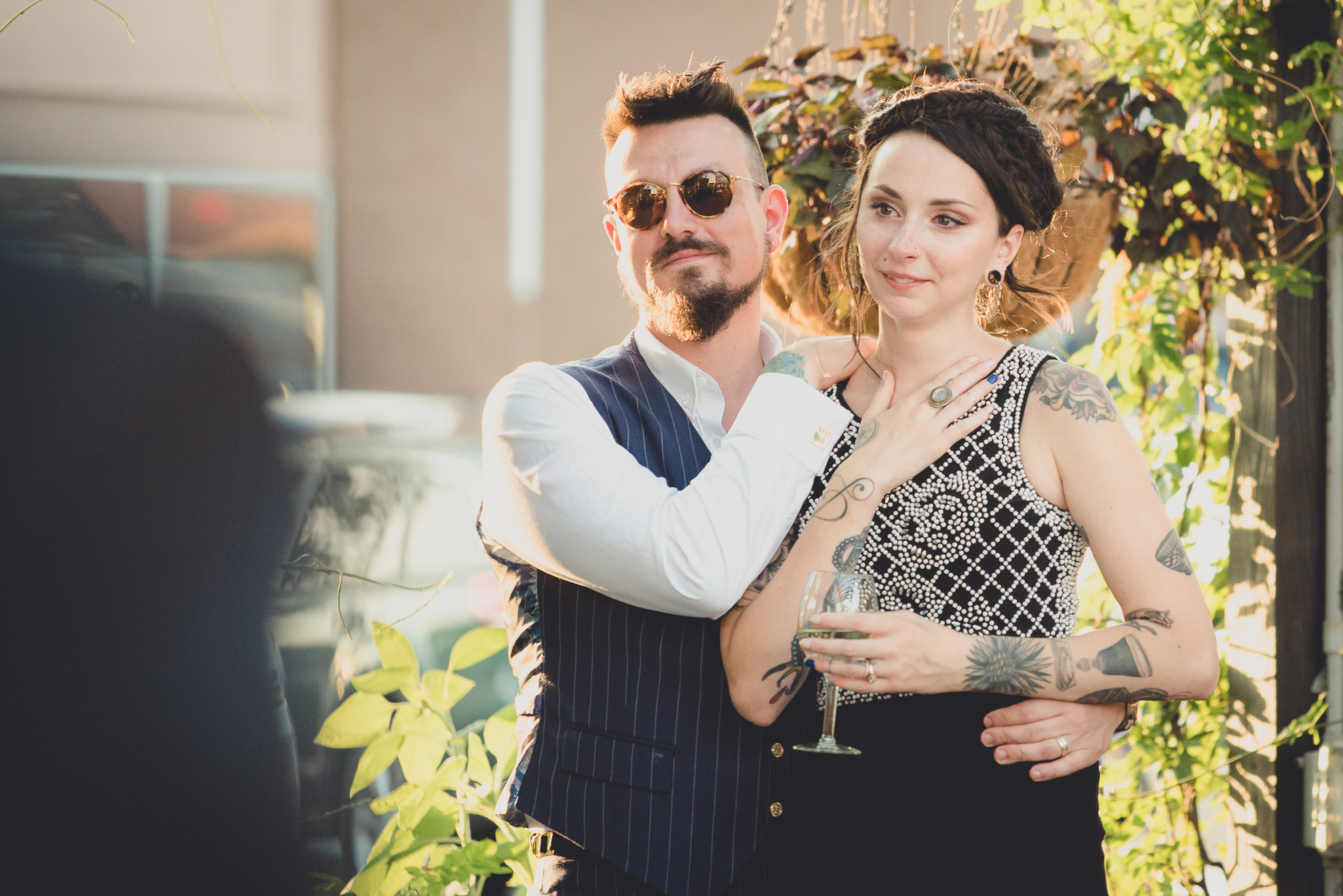 bride and groom react to speeches during outdoor wedding reception at the Revelry in Rochester, NY 