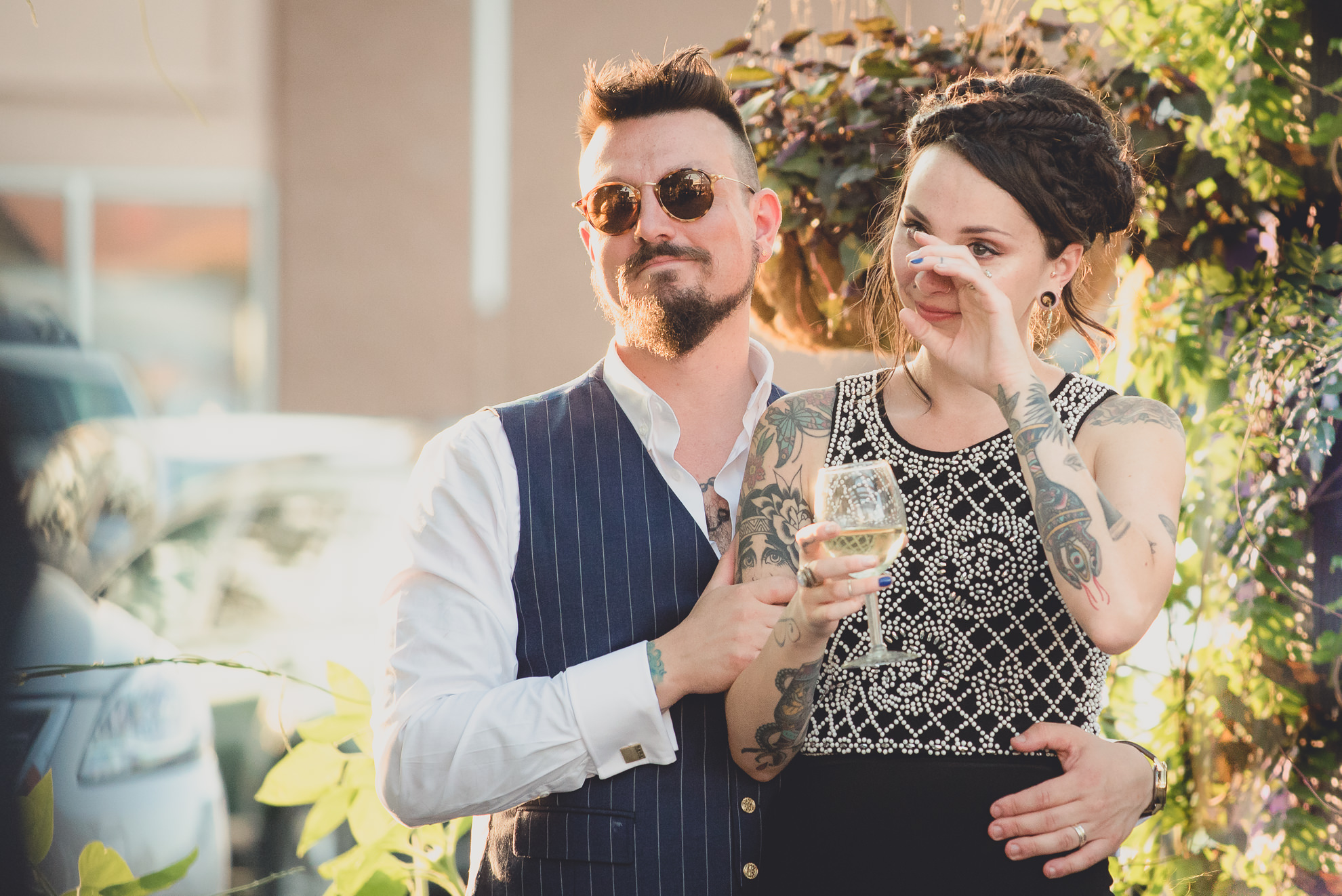 bride and groom react to speeches during outdoor wedding reception at the Revelry in Rochester, NY 