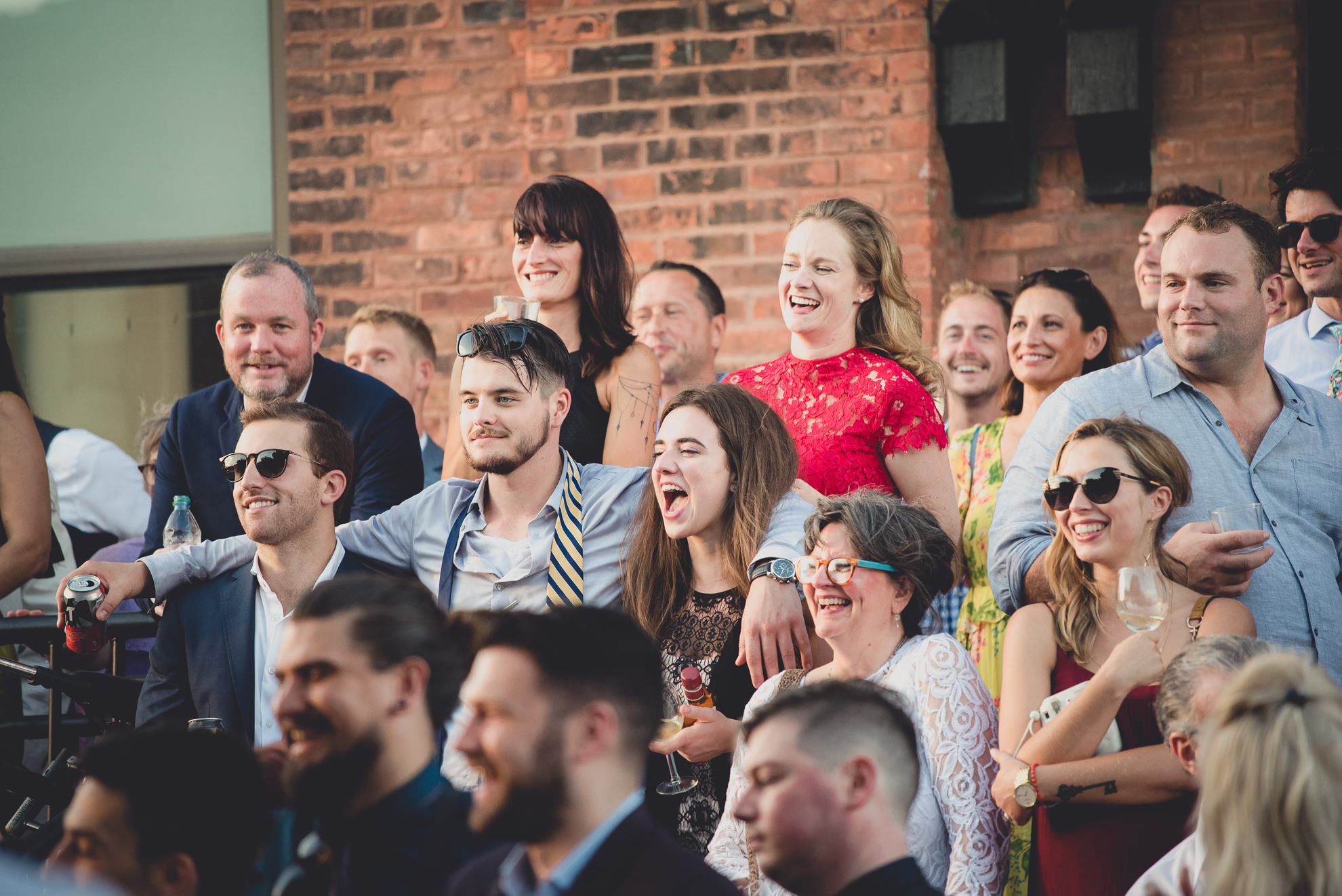 guests react to speeches during outdoor wedding reception at the Revelry in Rochester, NY 