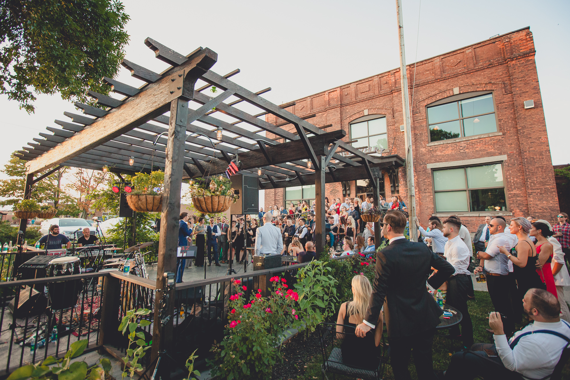 guests react to speeches during outdoor wedding reception at the Revelry in Rochester, NY 