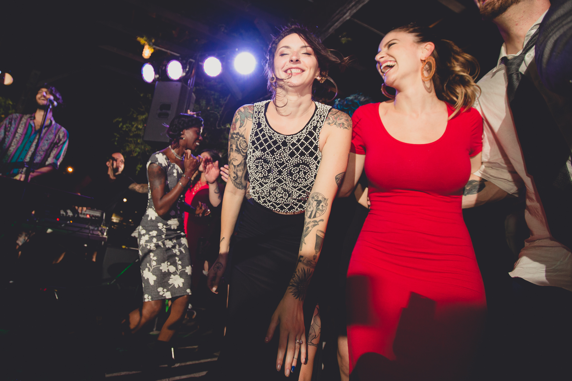 guests dance during outdoor wedding reception at the Revelry in Rochester, NY 