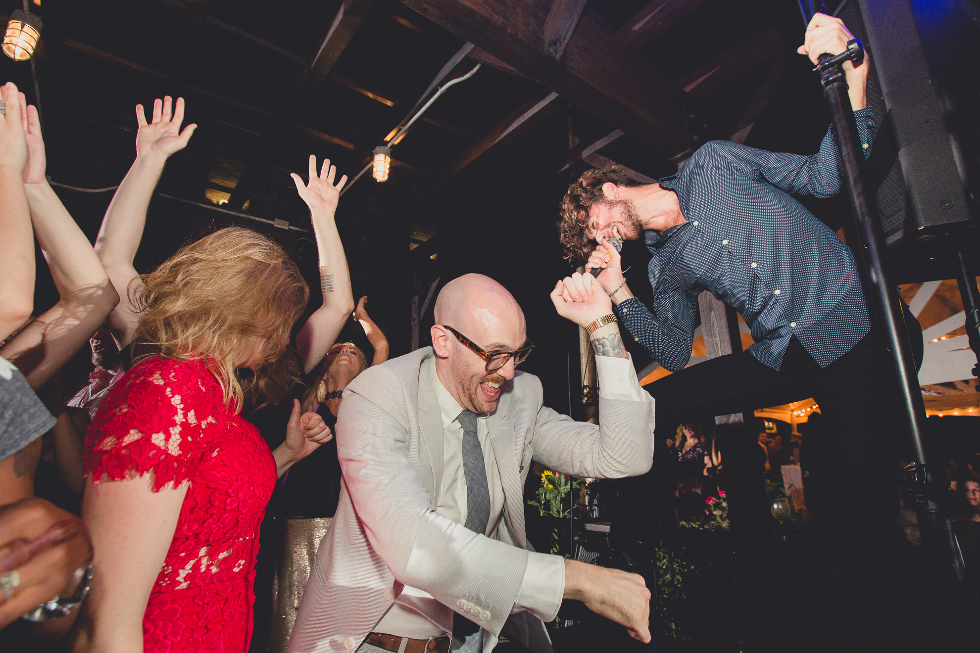 guests dance during outdoor wedding reception at the Revelry in Rochester, NY 