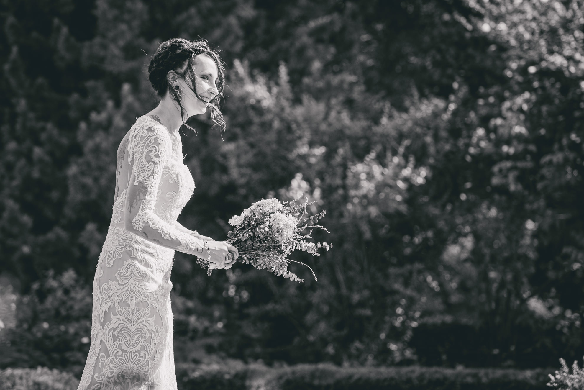 bride comes down aisle during garden wedding ceremony at the George Eastman House in Rochester, NY 