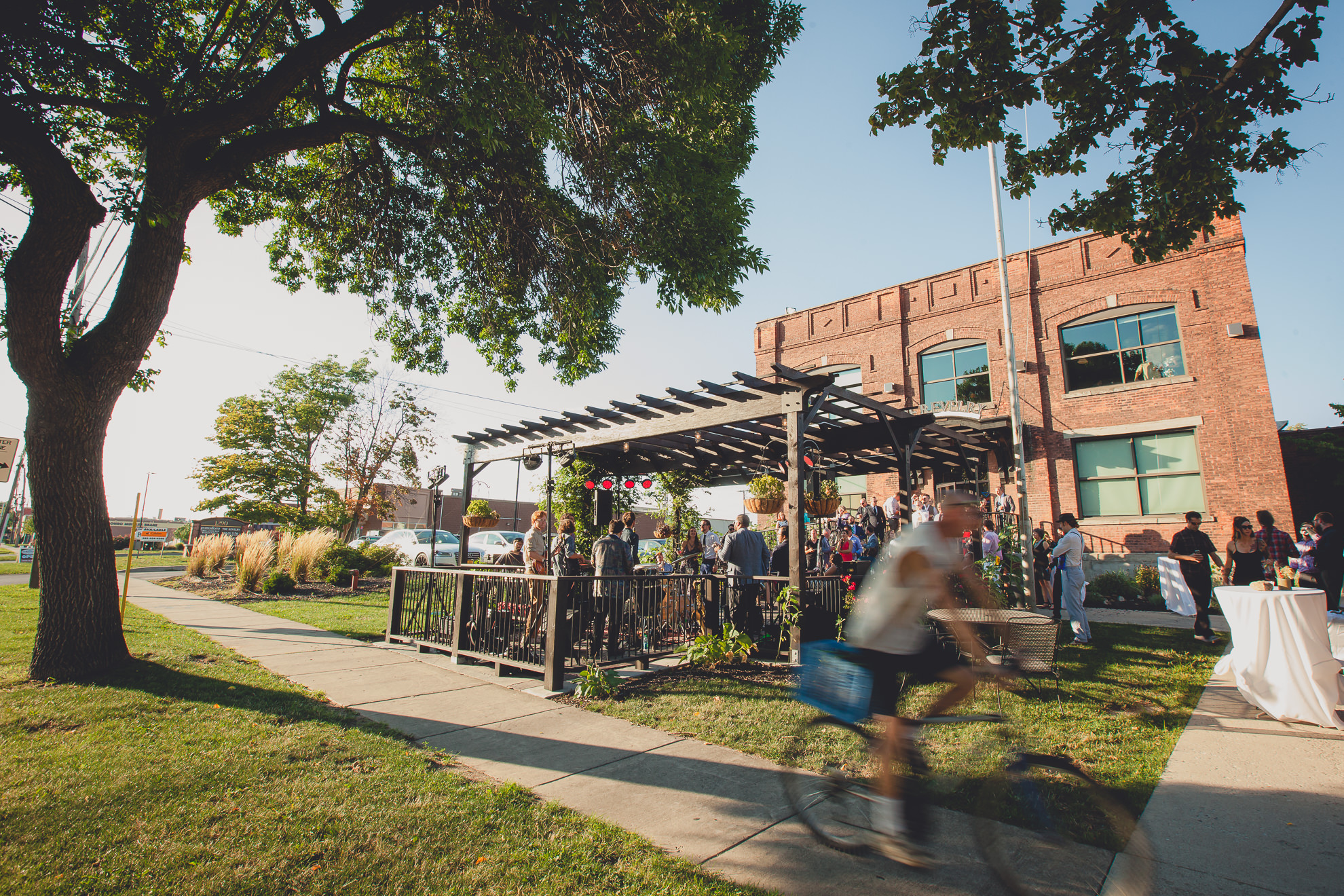 guests gather for cocktails and dancing during outdoor wedding reception at the Revelry in Rochester, NY 