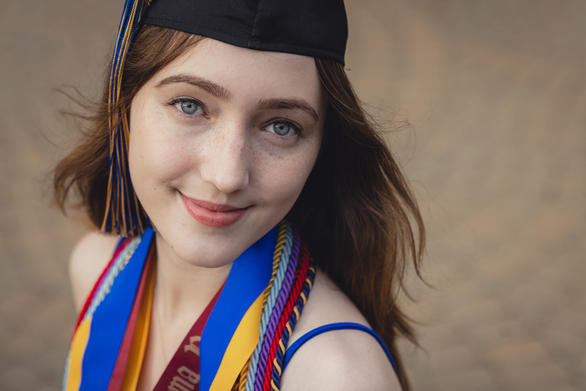 Canisius College senior poses for photographer during graduation portrait photography session on the Canisius campus in Buffalo, NY