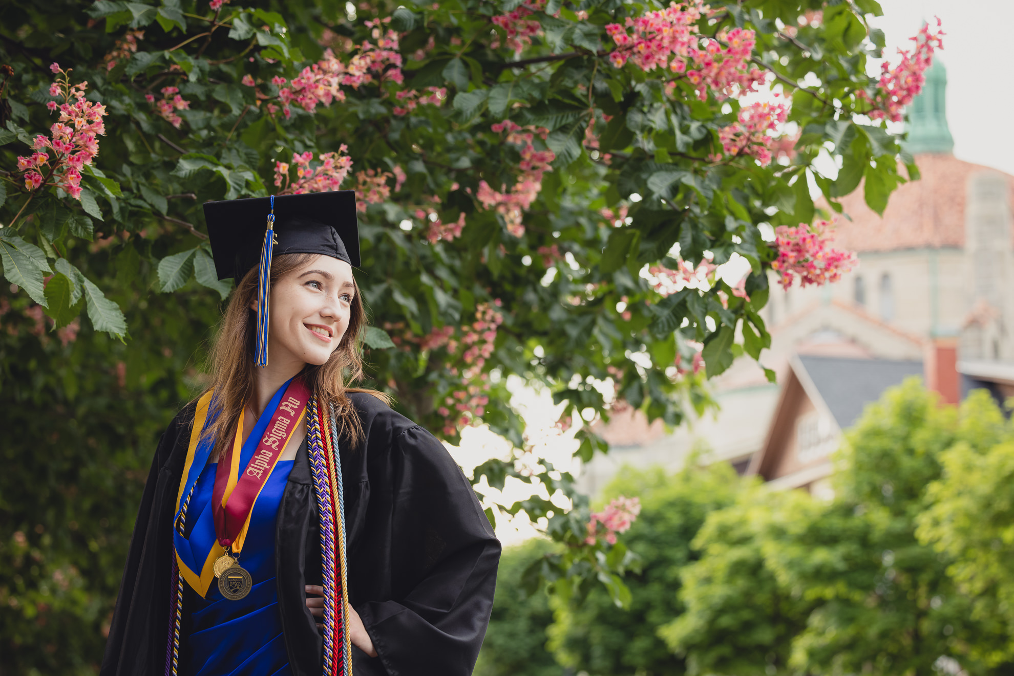Canisius College senior poses for photographer during graduation portrait photography session on the Canisius campus in Buffalo, NY