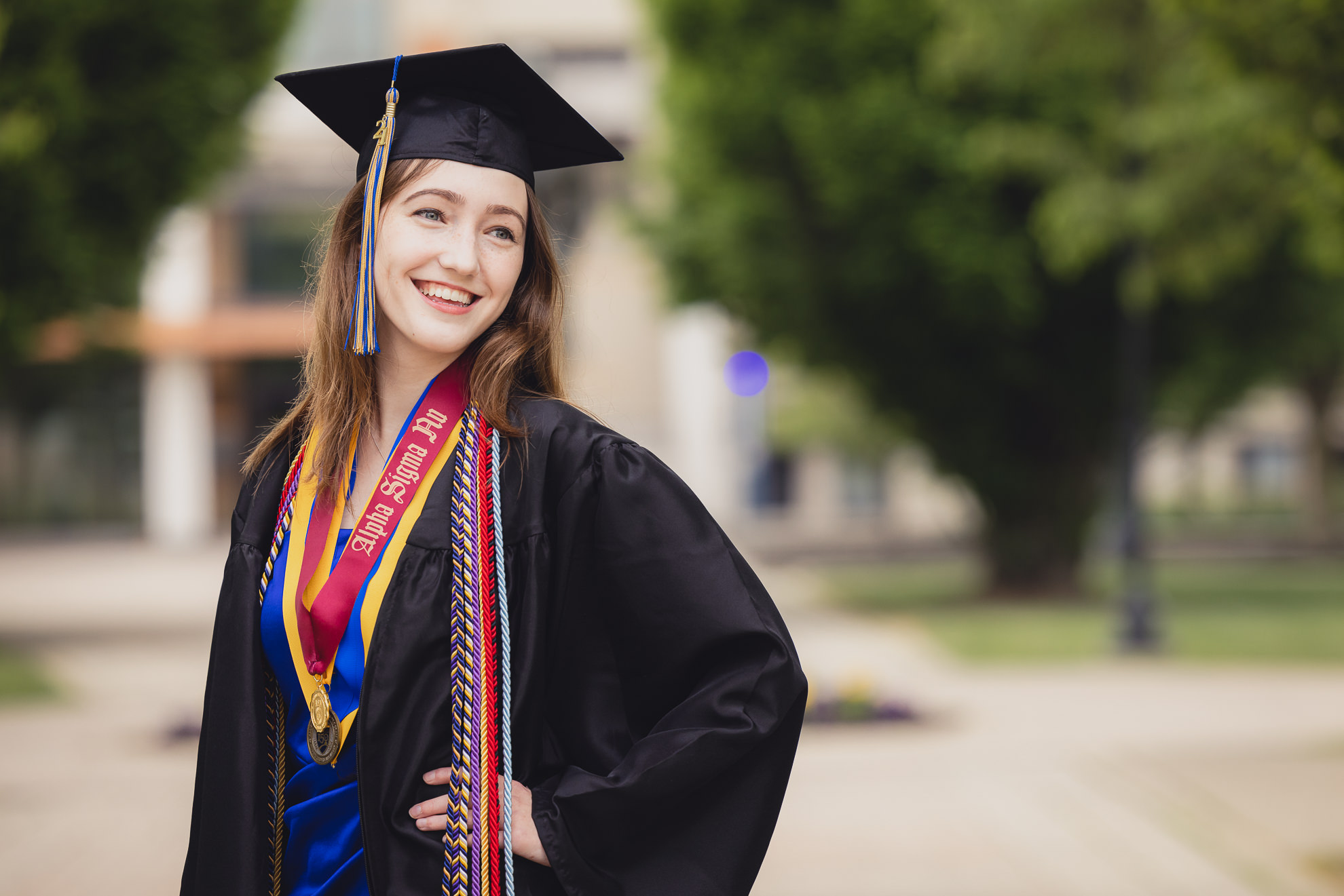 Canisius College senior poses for photographer during graduation portrait photography session on the Canisius campus in Buffalo, NY