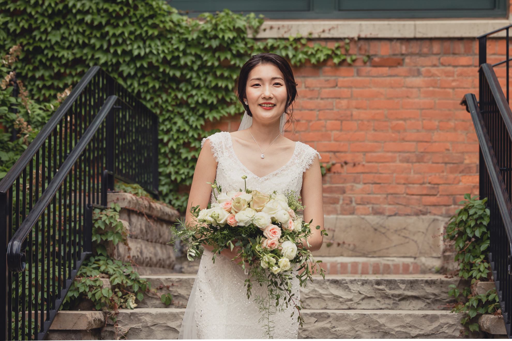 bride walks down aisle during wedding ceremony at the Foundry Suites in Buffalo, NY