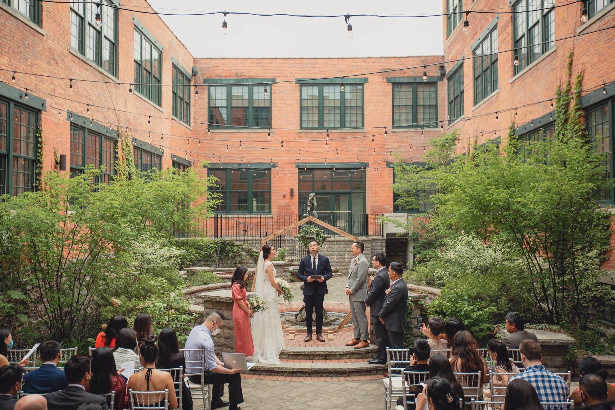 bride and groom sing during wedding ceremony at the Foundry Suites in Buffalo, NY