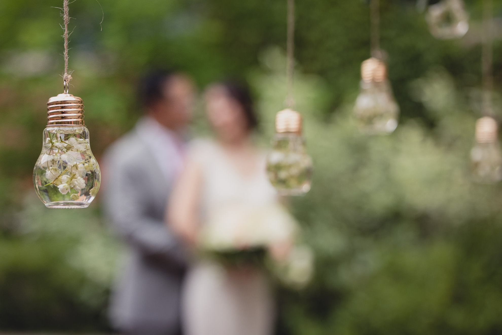 bride and groom pose for photographer during wedding at the Foundry Suites in Buffalo, NY