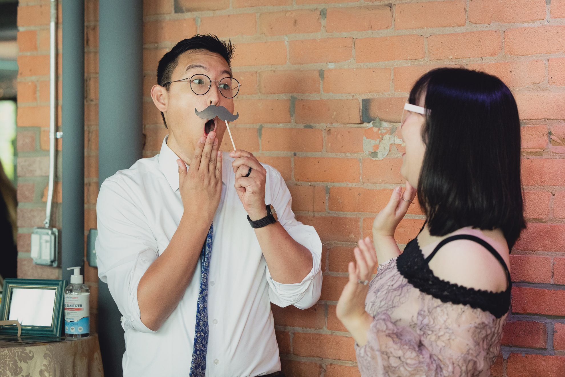 guests use photobooth during wedding reception at the Foundry Suites in Buffalo, NY