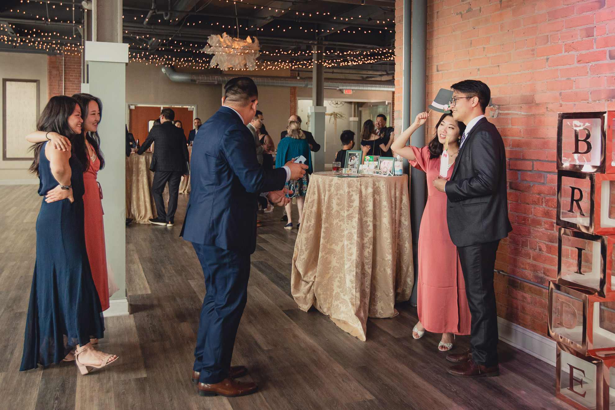 guests use photo booth during wedding reception at the Foundry Suites in Buffalo, NY