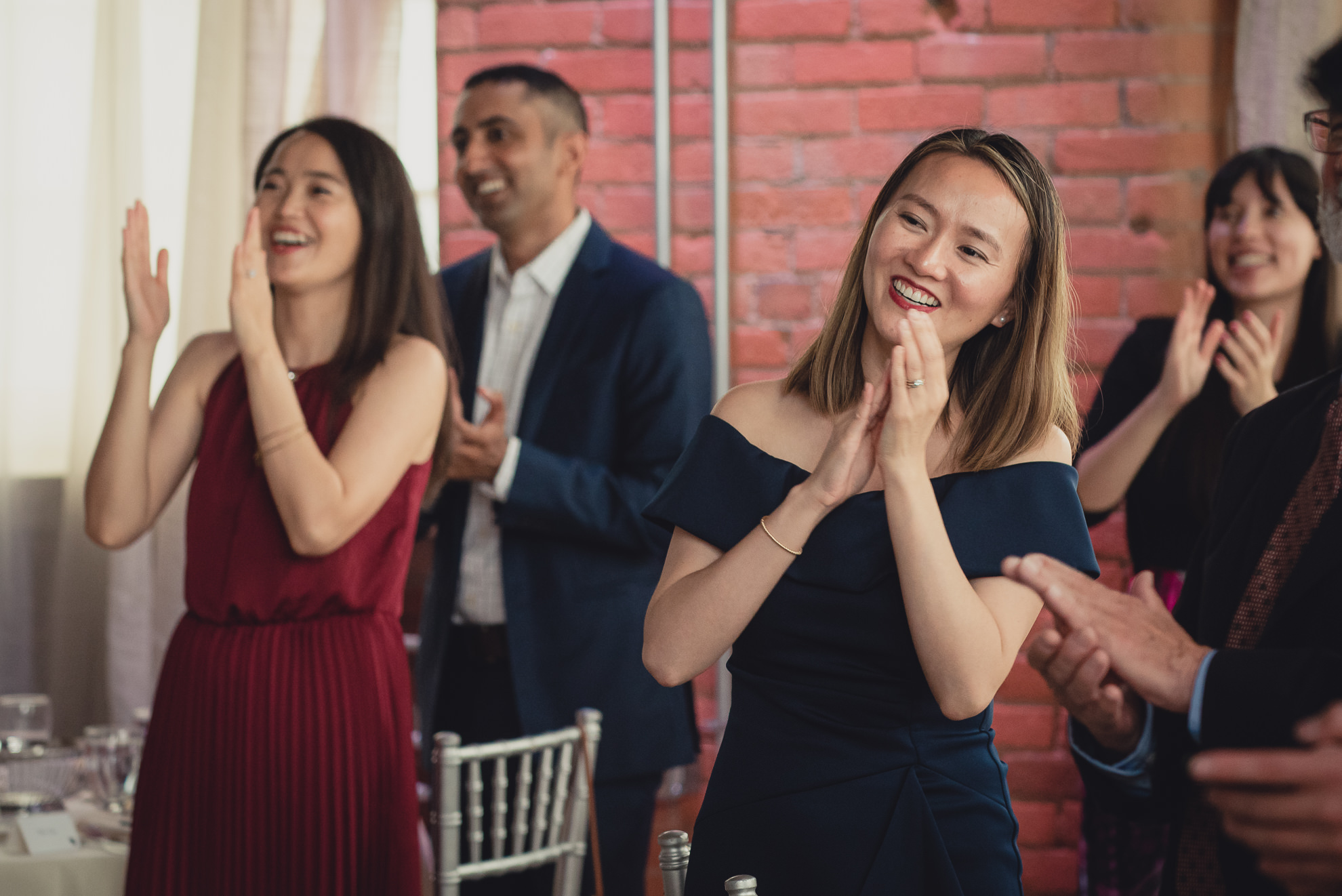 guests clap as wedding party is introduced during wedding reception at the Foundry Suites in Buffalo, NY