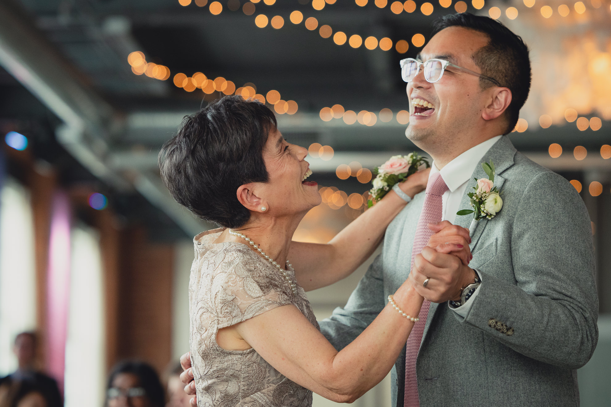 groom and mother dance during wedding reception at the Foundry Suites in Buffalo, NY