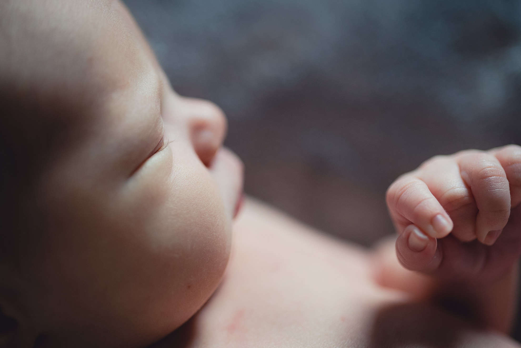 babies eye lashes and hands during newborn baby family photography session in Buffalo, NY