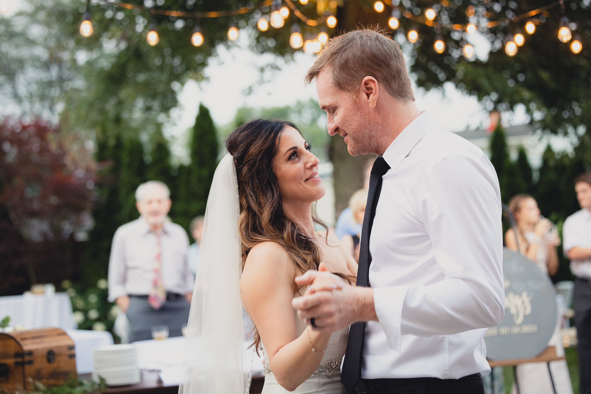 bride and groom dance during their backyard tented wedding in Buffalo, NY