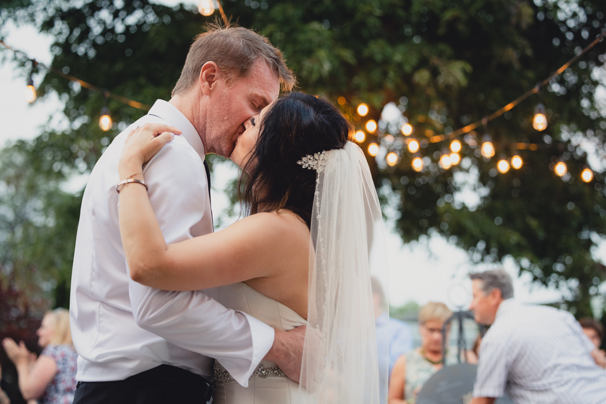 bride and groom dance during their backyard tented wedding in Buffalo, NY