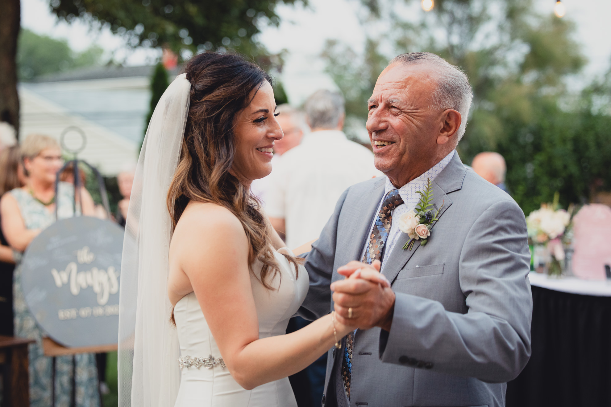 bride and father dance during their backyard tented wedding in Buffalo, NY