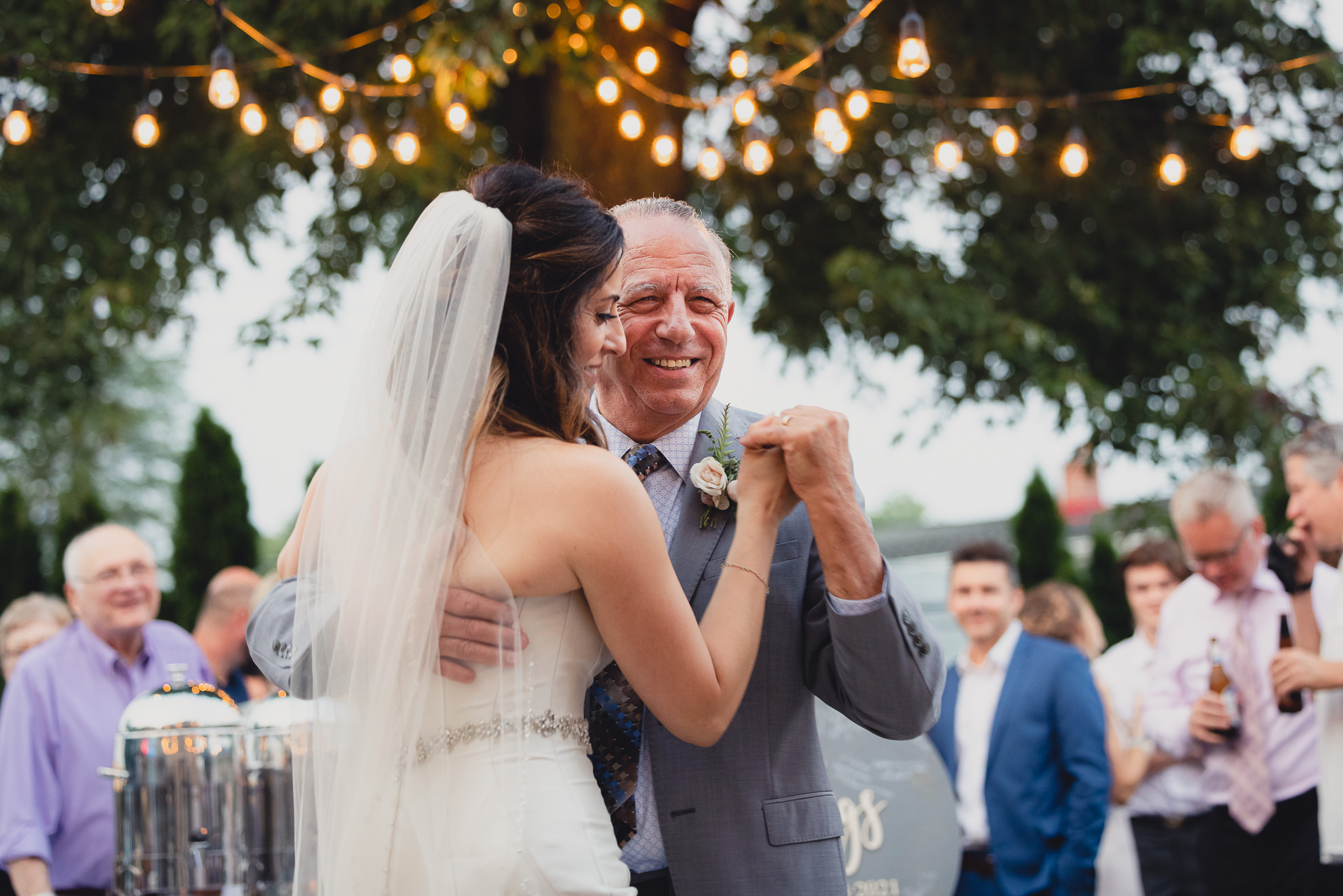 bride and father dance during their backyard tented wedding in Buffalo, NY