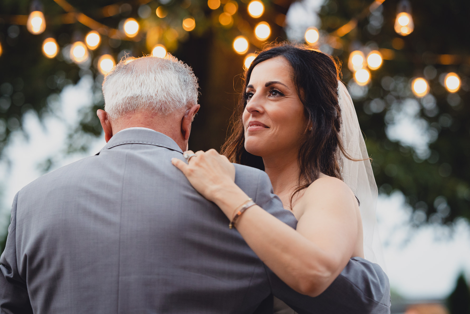 bride and father dance during their backyard tented wedding in Buffalo, NY