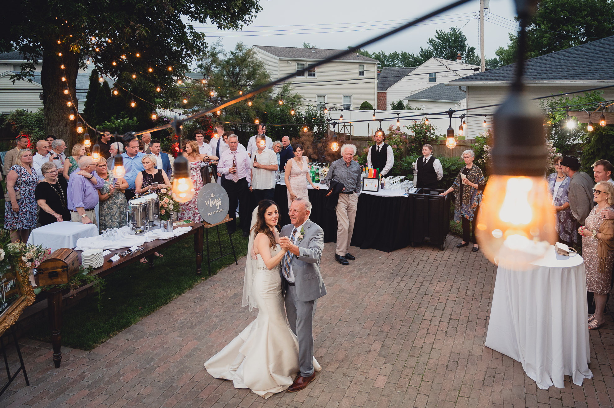 bride and father dance during their backyard tented wedding in Buffalo, NY