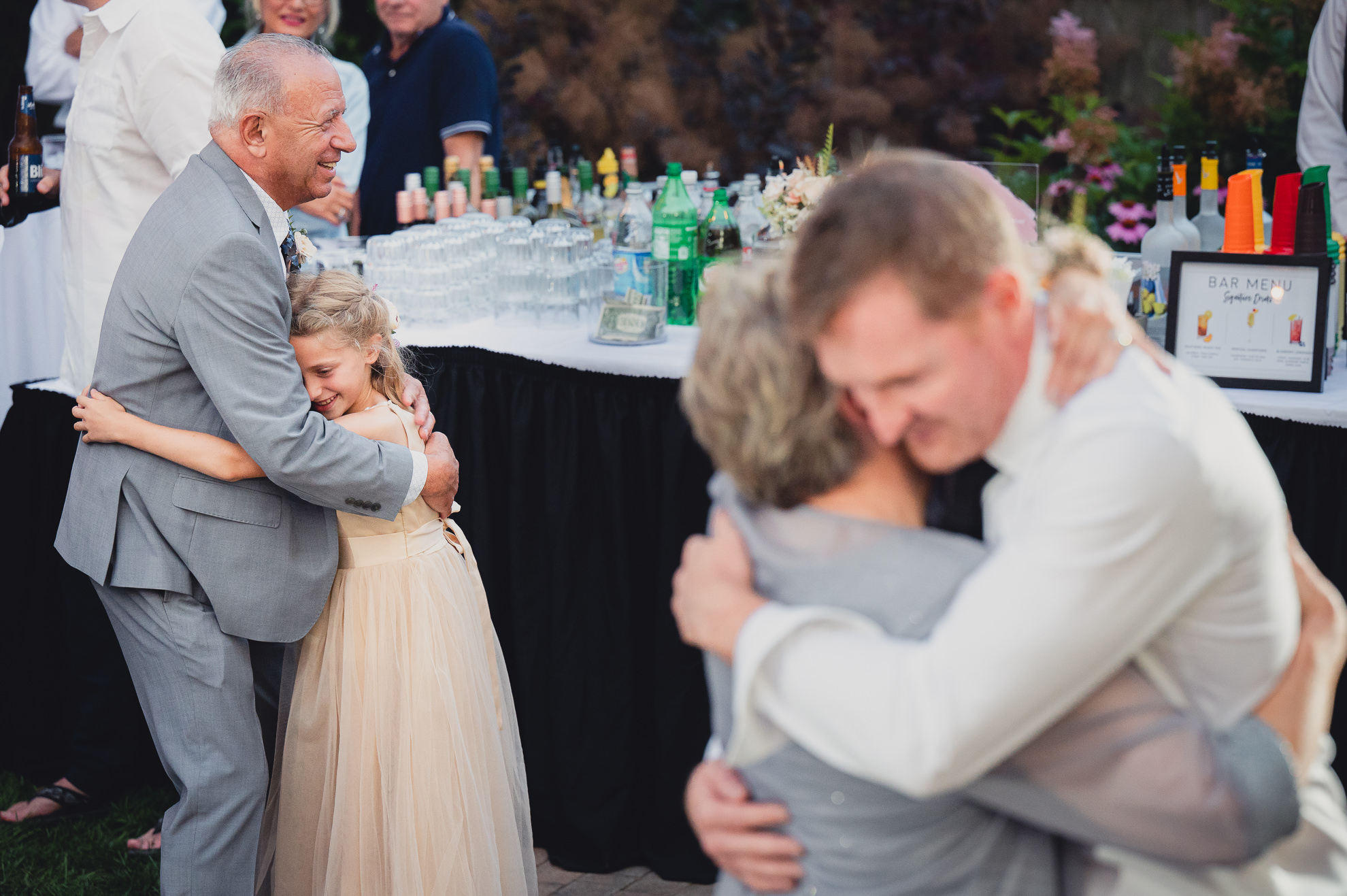 groom and mother dance during their backyard tented wedding in Buffalo, NY