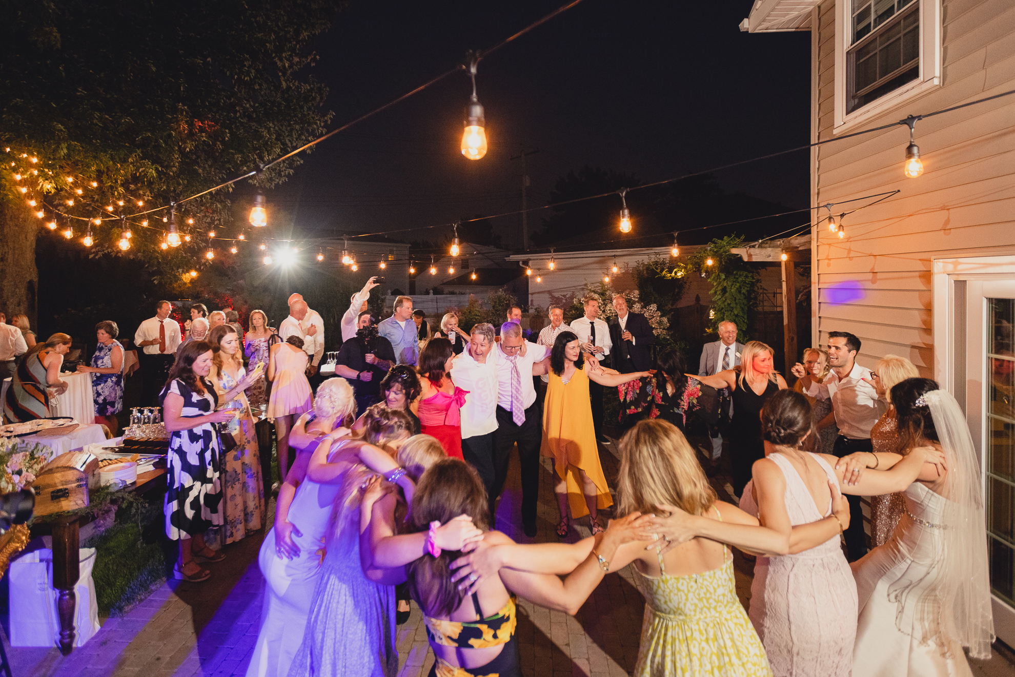 guests dance at backyard tented wedding in Buffalo, NY
