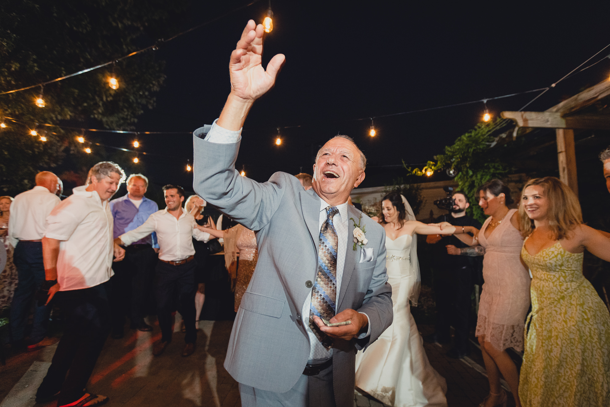 guests dance at backyard tented wedding in Buffalo, NY