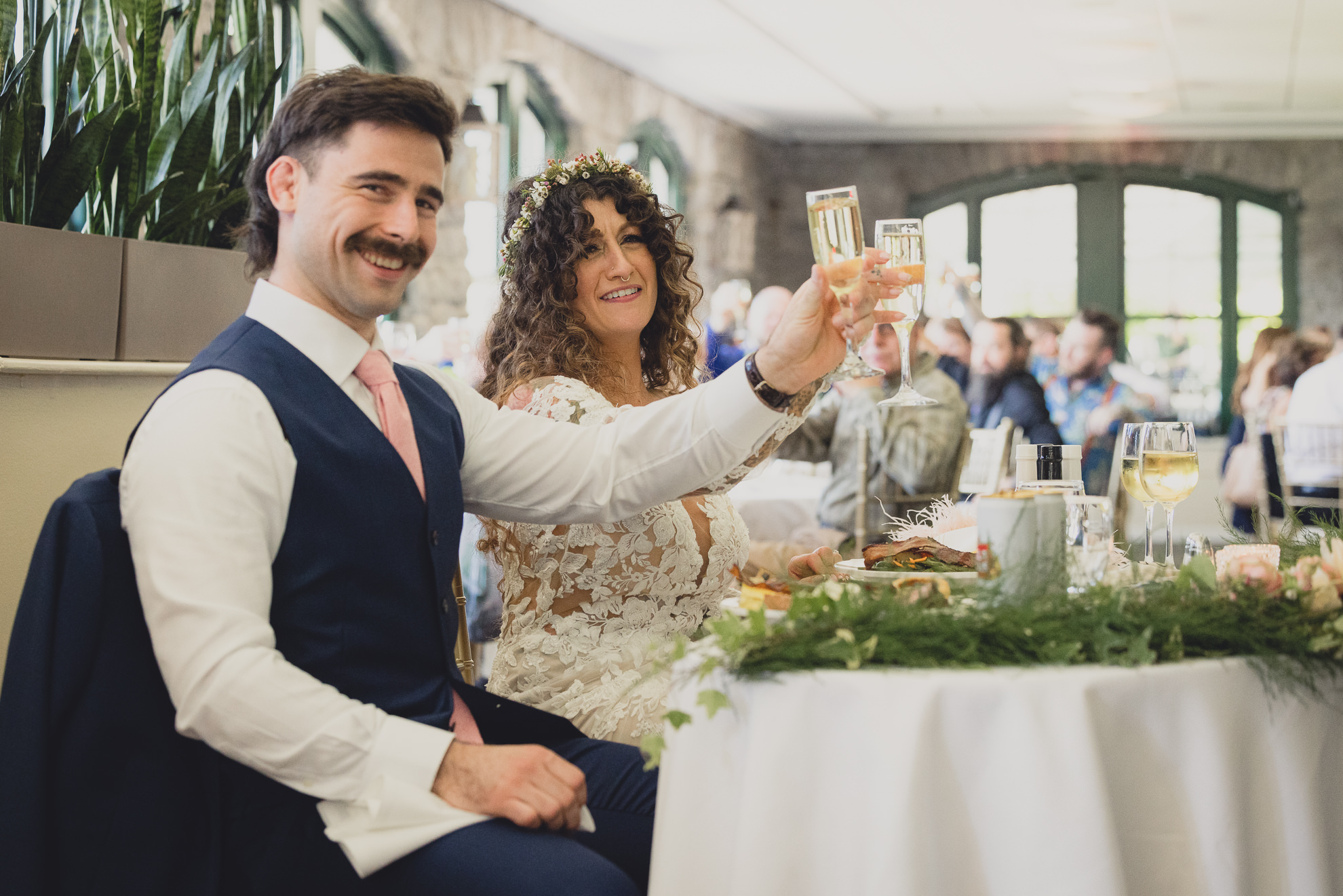 bride and groom toast at the terrace at marcy casino in Buffalo, NYthe terrace at marcy casino in Buffalo, NY